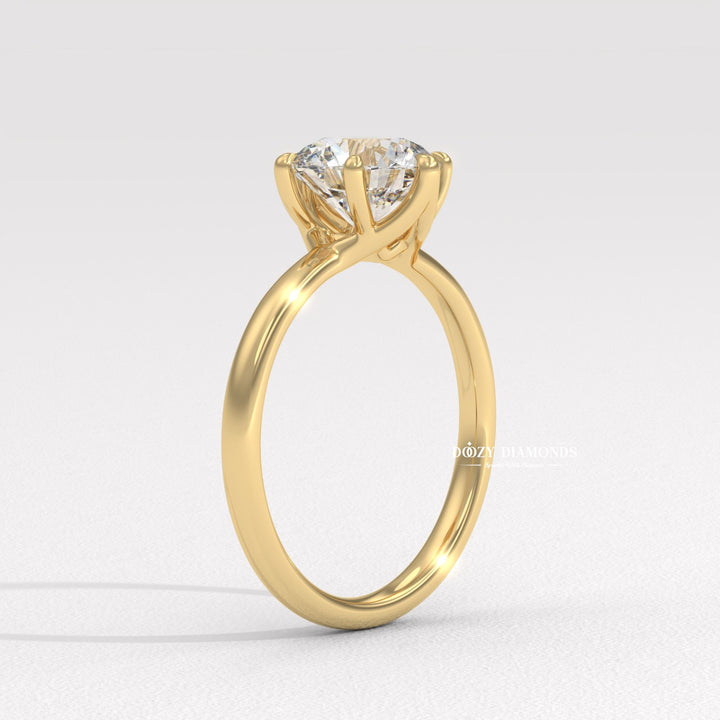 Round cut engagement ring shown with authenticity certificate