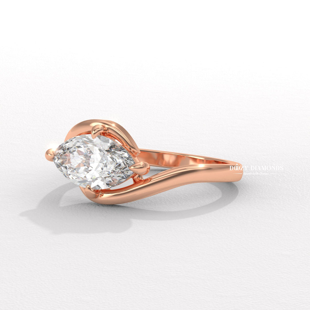 Side angle of marquise east west diamond engagement ring