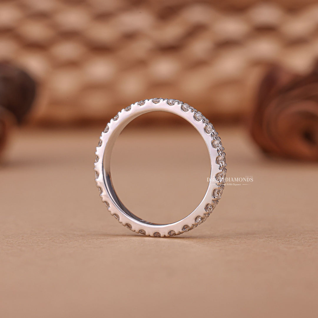 Round diamond band stacked with engagement ring