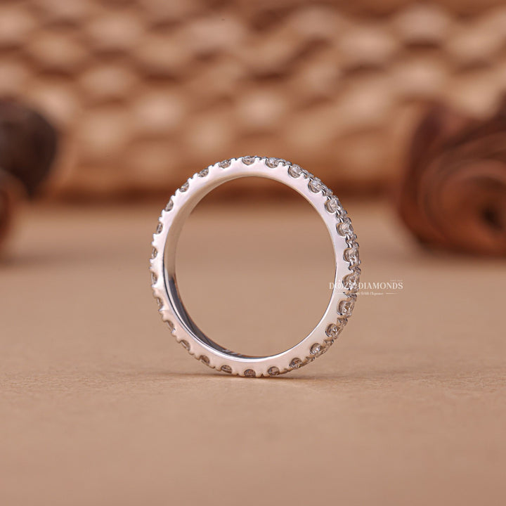 Round diamond band stacked with engagement ring