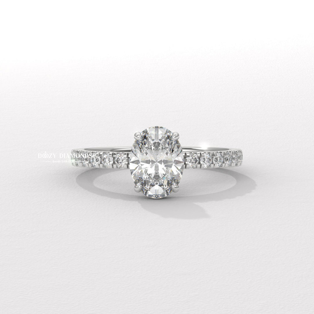 Oval hidden halo engagement ring finished in polished solid gold