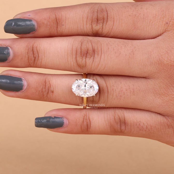 Close-up of oval cut center diamond in hidden halo engagement ring