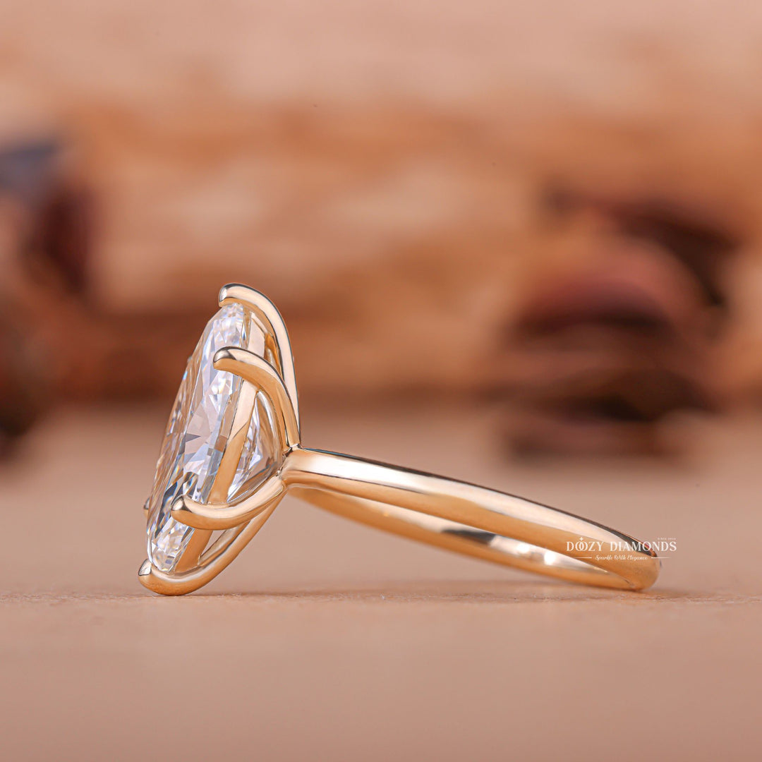 Fine craftsmanship detail on marquise solitaire engagement ring