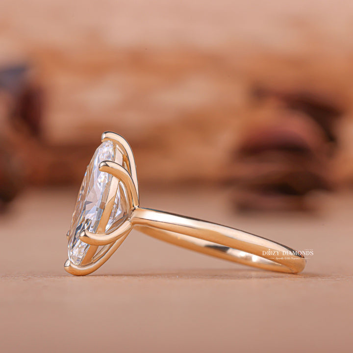 Fine craftsmanship detail on marquise solitaire engagement ring