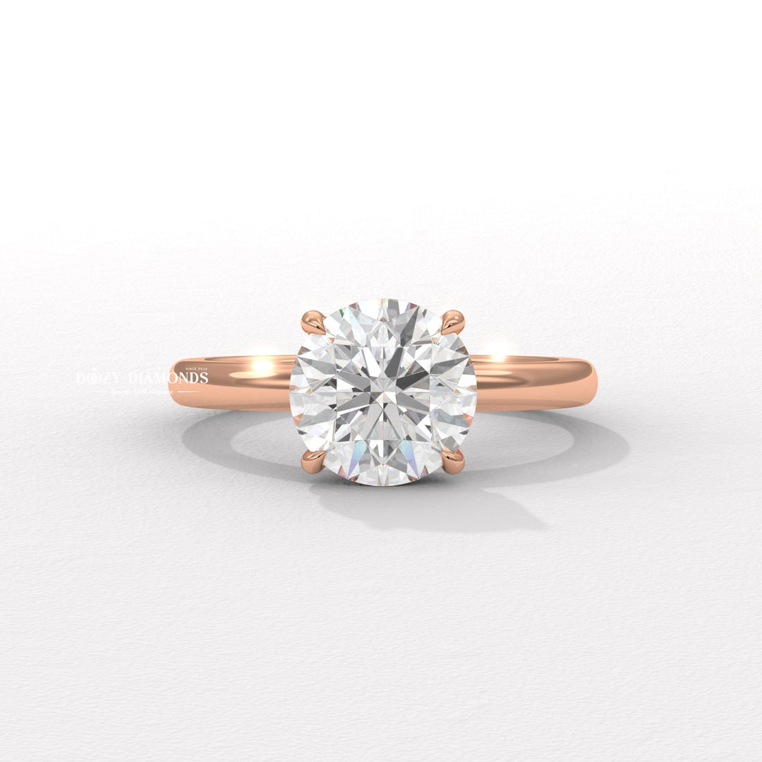 Round hidden halo engagement ring finished in polished solid gold