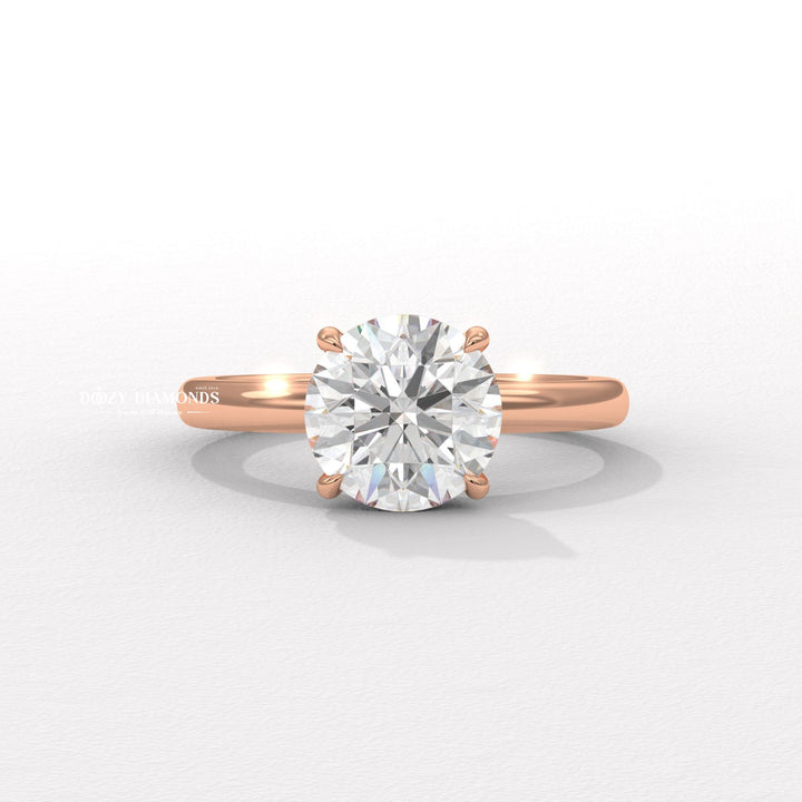 Round hidden halo engagement ring finished in polished solid gold