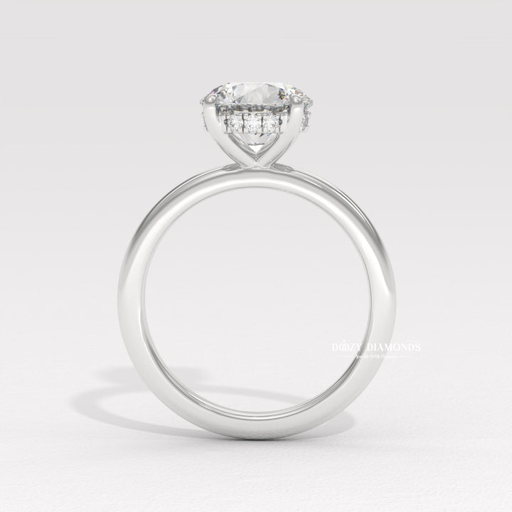 Round hidden halo engagement ring close-up showing high clarity diamond clarity