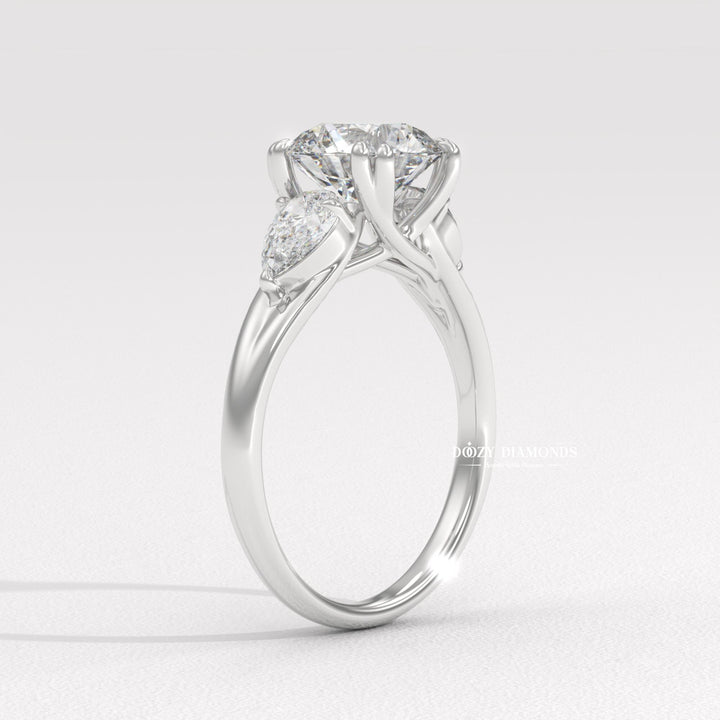 Profile view of round cut three stone engagement ring band