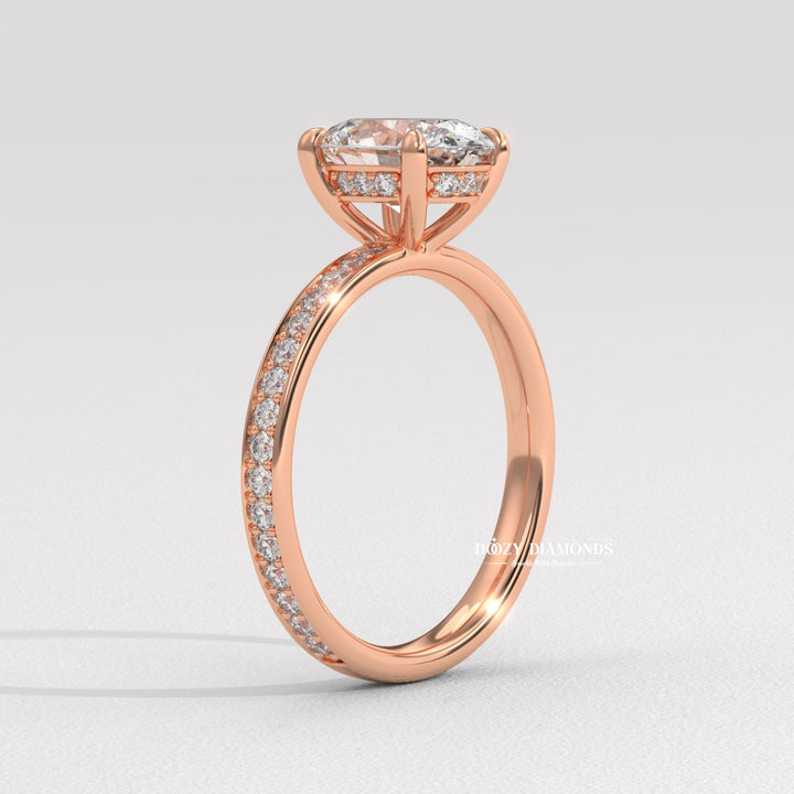 Oval solitaire engagement ring viewed from the side