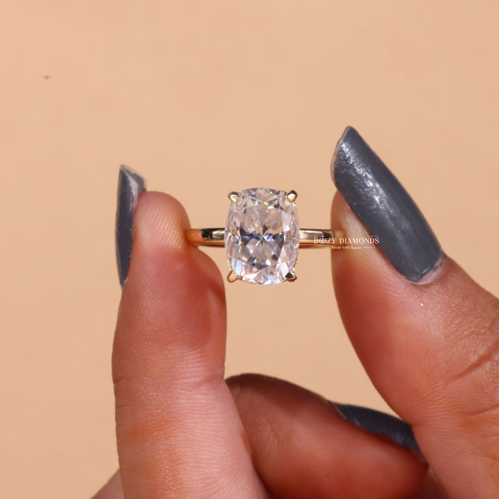 Lifestyle shot of cushion hidden halo diamond ring on hand