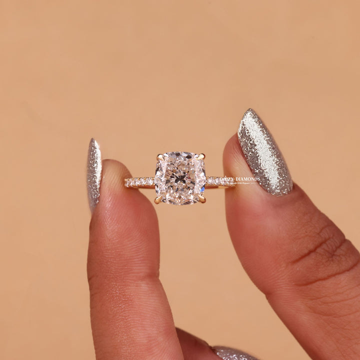 Lifestyle shot of cushion hidden halo diamond ring on hand