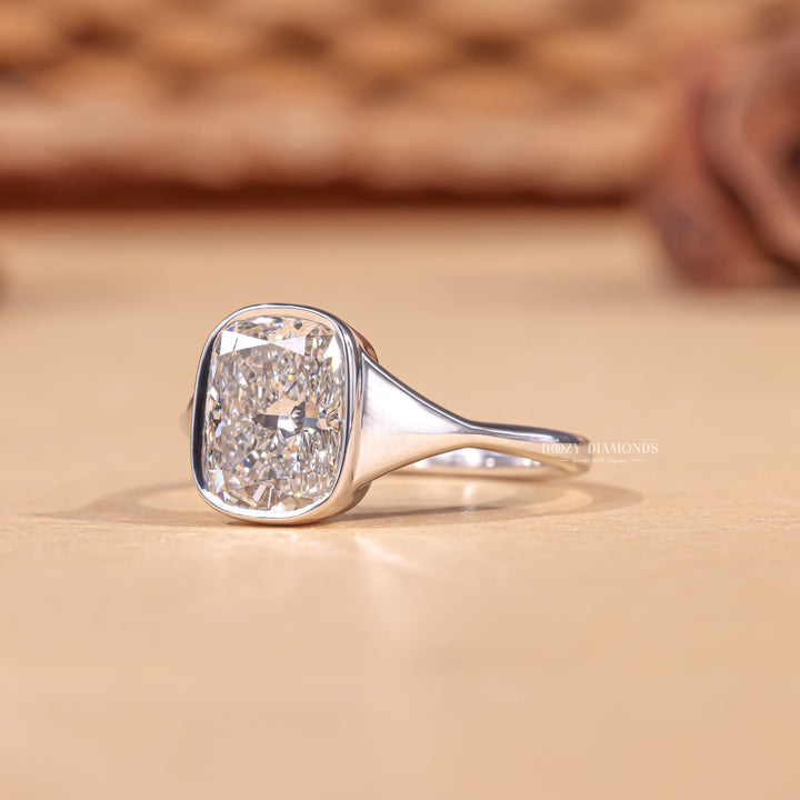 Lifestyle shot of cushion bezel diamond ring on hand