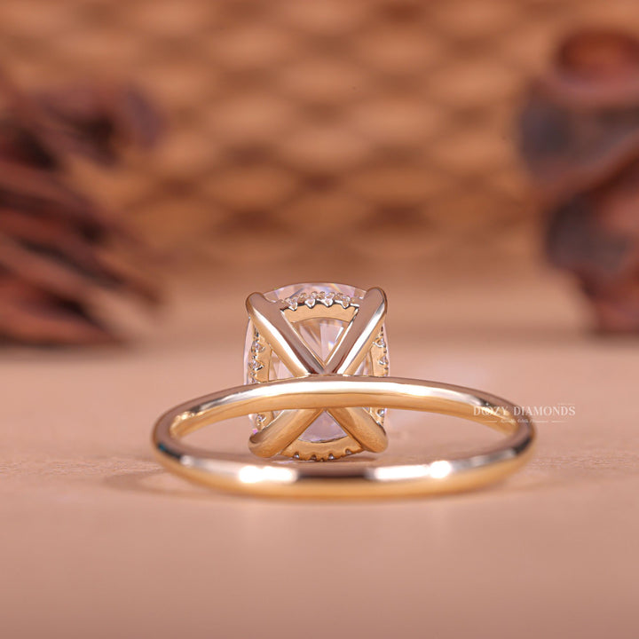 Fine craftsmanship detail on cushion hidden halo engagement ring