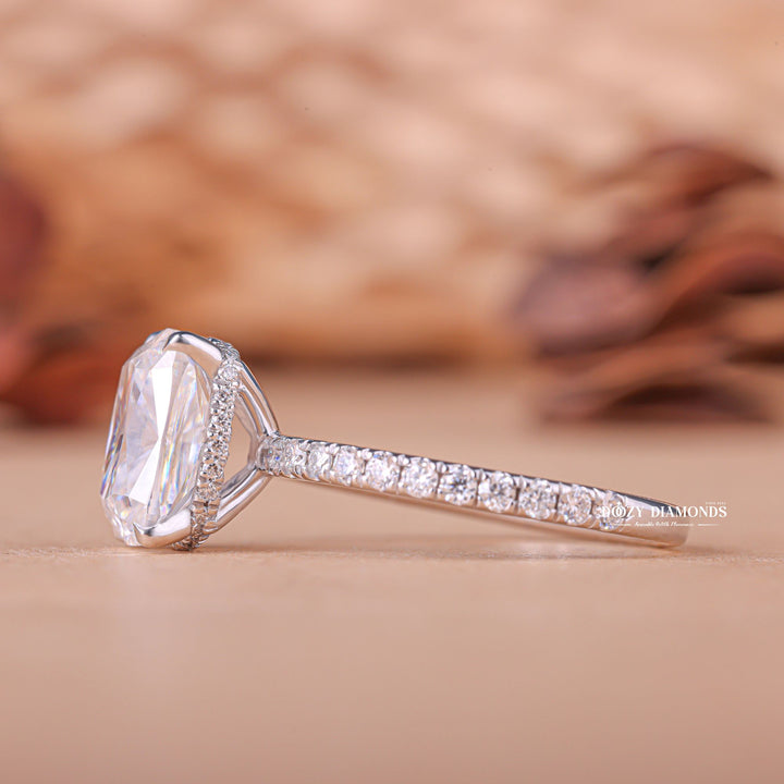 Angled view of cushion cut diamond in hidden halo setting