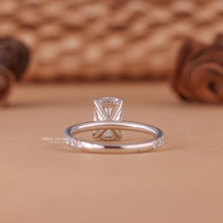 Angled view of cushion cut diamond in pave setting