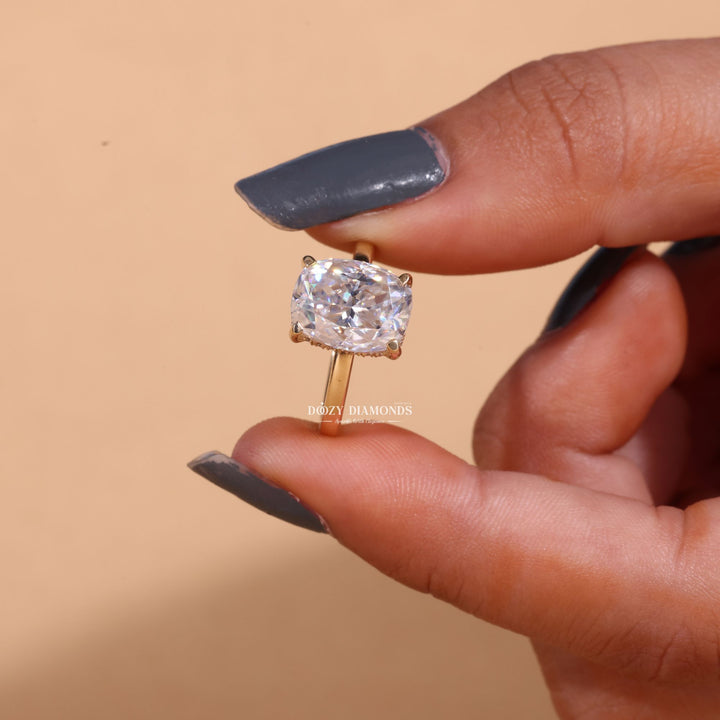 Cushion hidden halo lab grown diamond ring fitted on finger