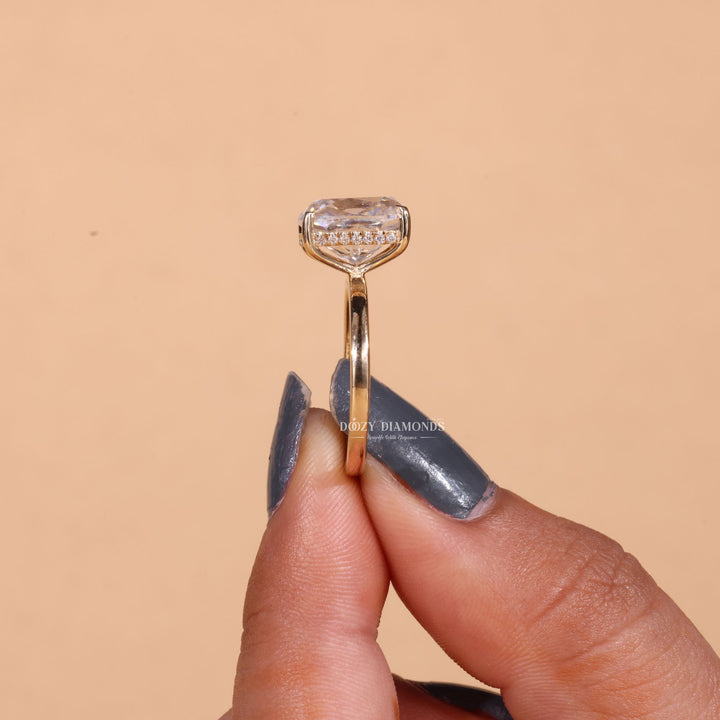 Cushion cut diamond ring worn on hand