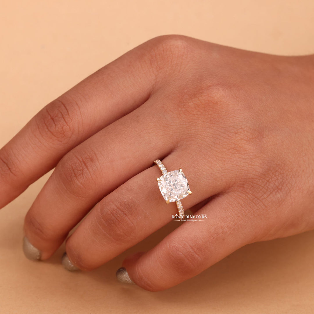 Cushion hidden halo lab grown diamond ring fitted on finger