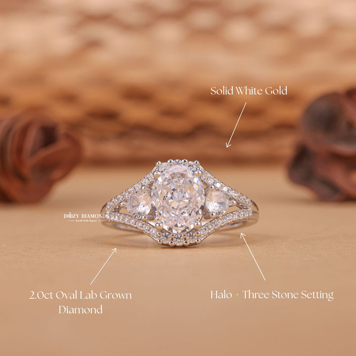 Macro shot of oval cut diamond facets in three stone ring setting