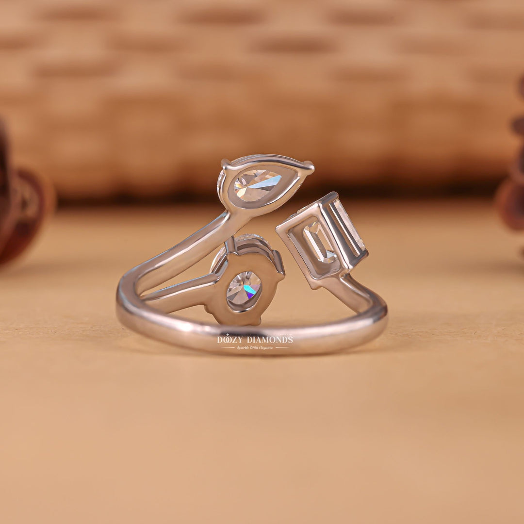 Top-down view of oval cut three stone engagement ring