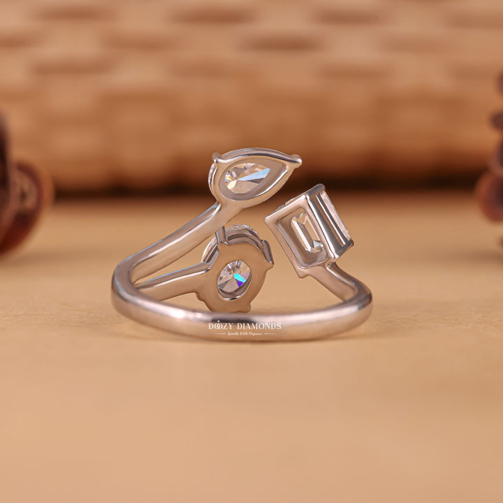 Top-down view of oval cut three stone engagement ring