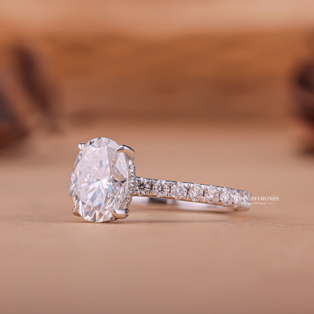 Oval hidden halo ring set with an IGI graded diamond