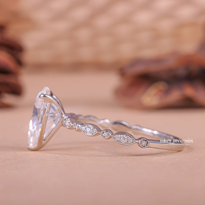 Shop the pear cut pave engagement ring collection online