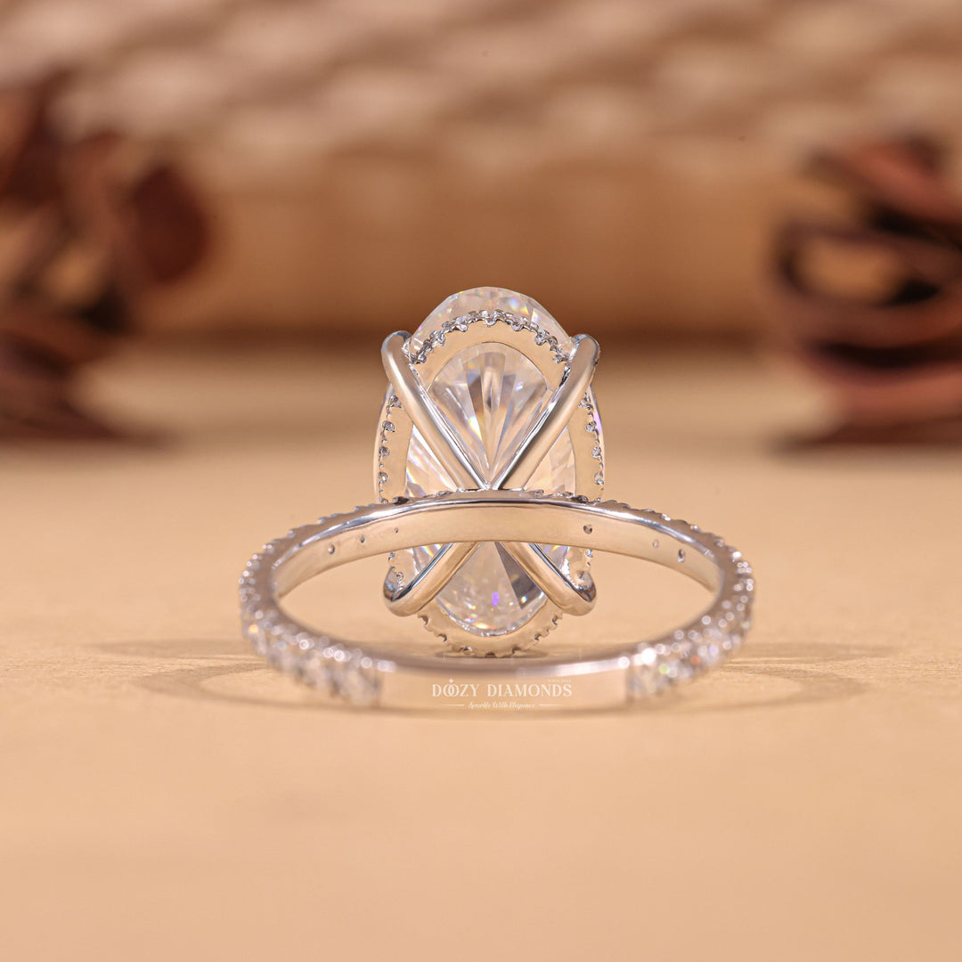 Fine craftsmanship detail on oval hidden halo engagement ring