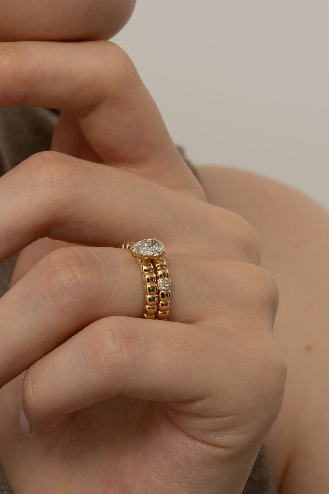 Macro shot of pear cut diamond facets in solitaire ring setting