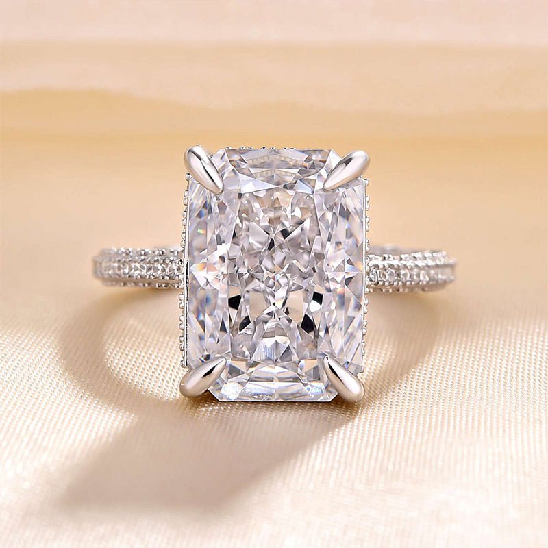 Radiant cut engagement ring shown with authenticity certificate