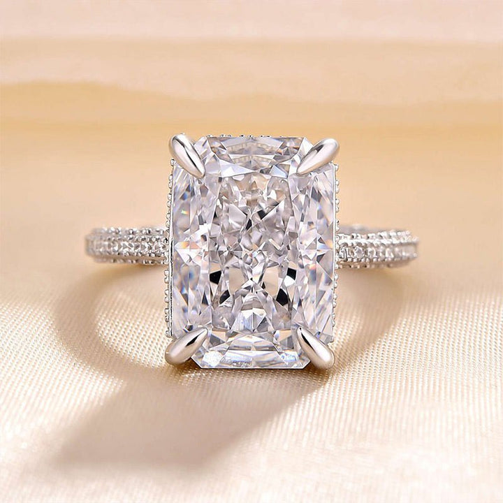 Radiant cut engagement ring shown with authenticity certificate