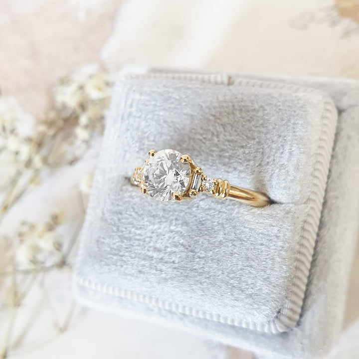 Top-down view of round cut cluster engagement ring