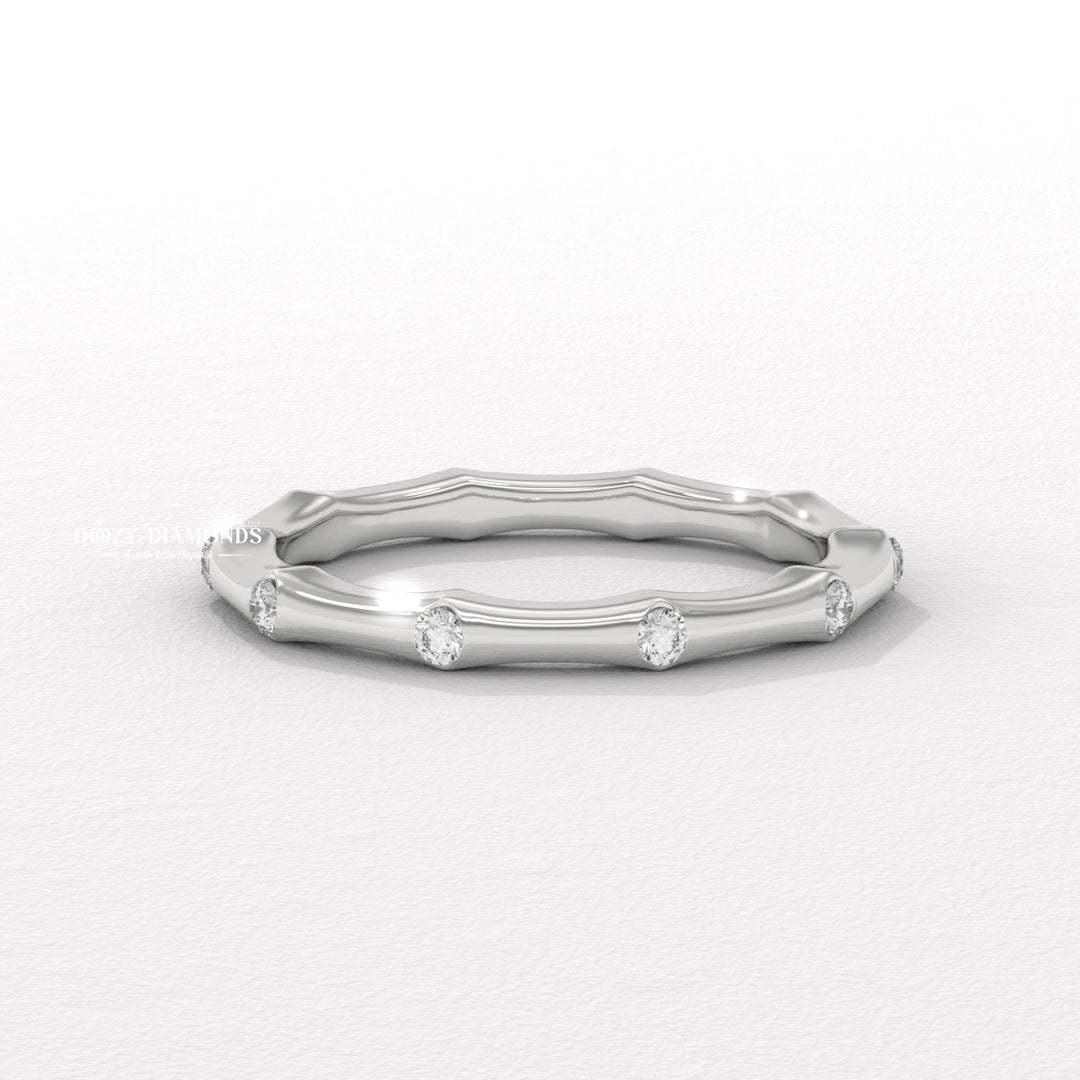 Dainty diamond wedding band in yellow gold