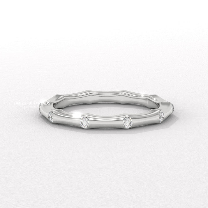 Dainty diamond wedding band in yellow gold