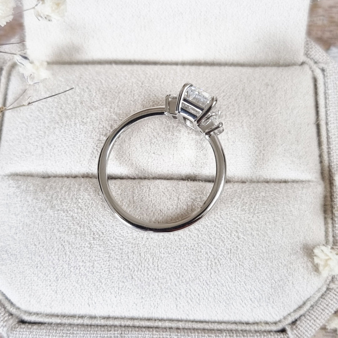 Emerald three stone engagement ring offered in gold and platinum