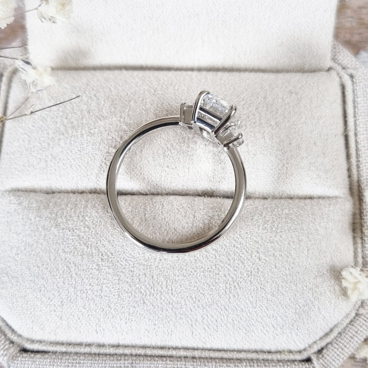 Emerald three stone engagement ring offered in gold and platinum