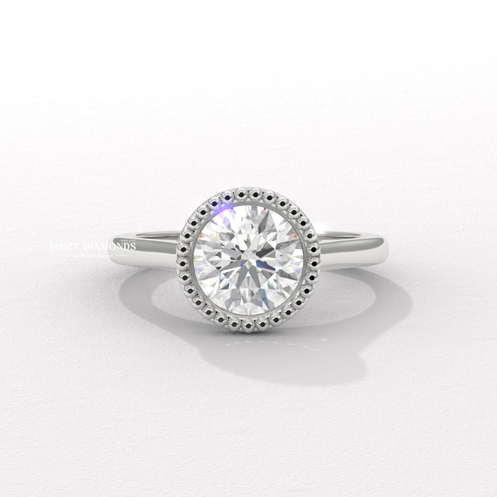 Side angle of round bezel diamond engagement ring