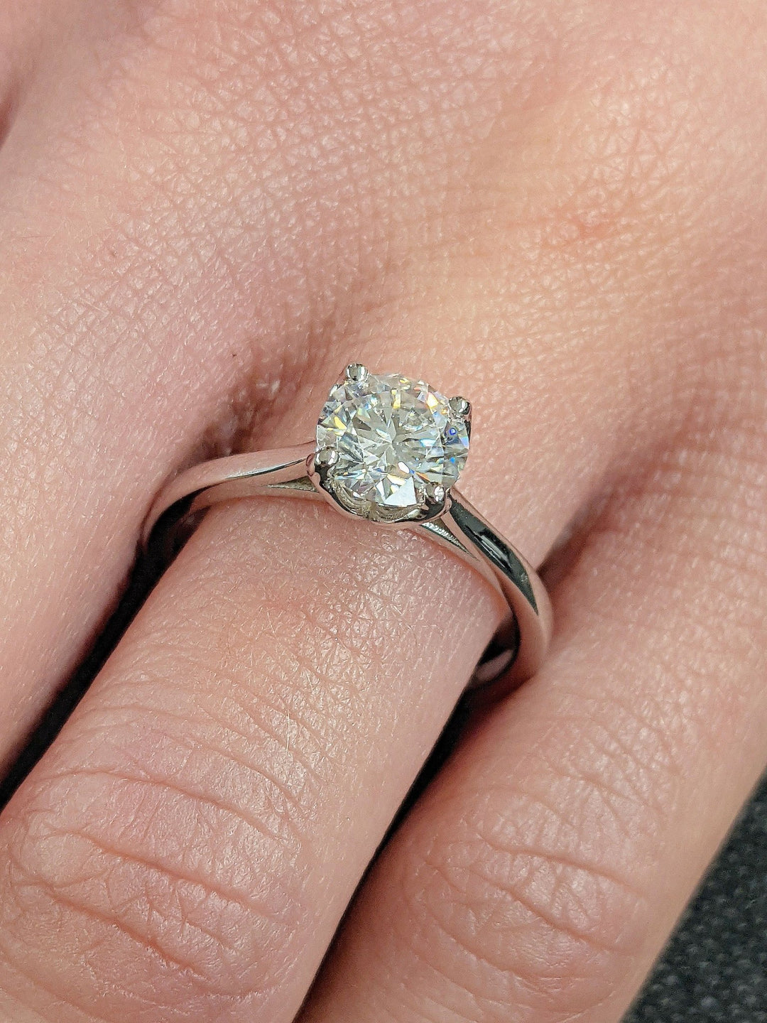 Round cut engagement ring side view showing band detail