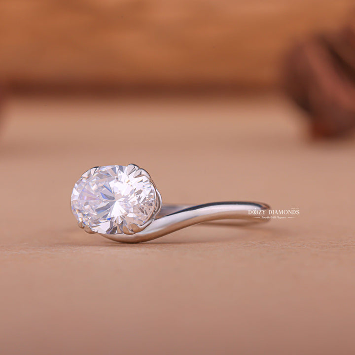 Premium oval cut east west engagement ring crafted in solid gold