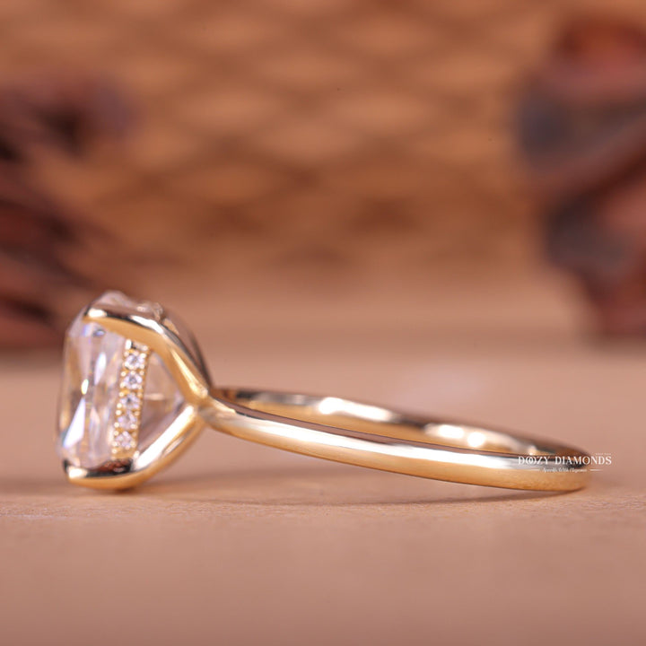 Cushion hidden halo engagement ring finished in polished solid gold