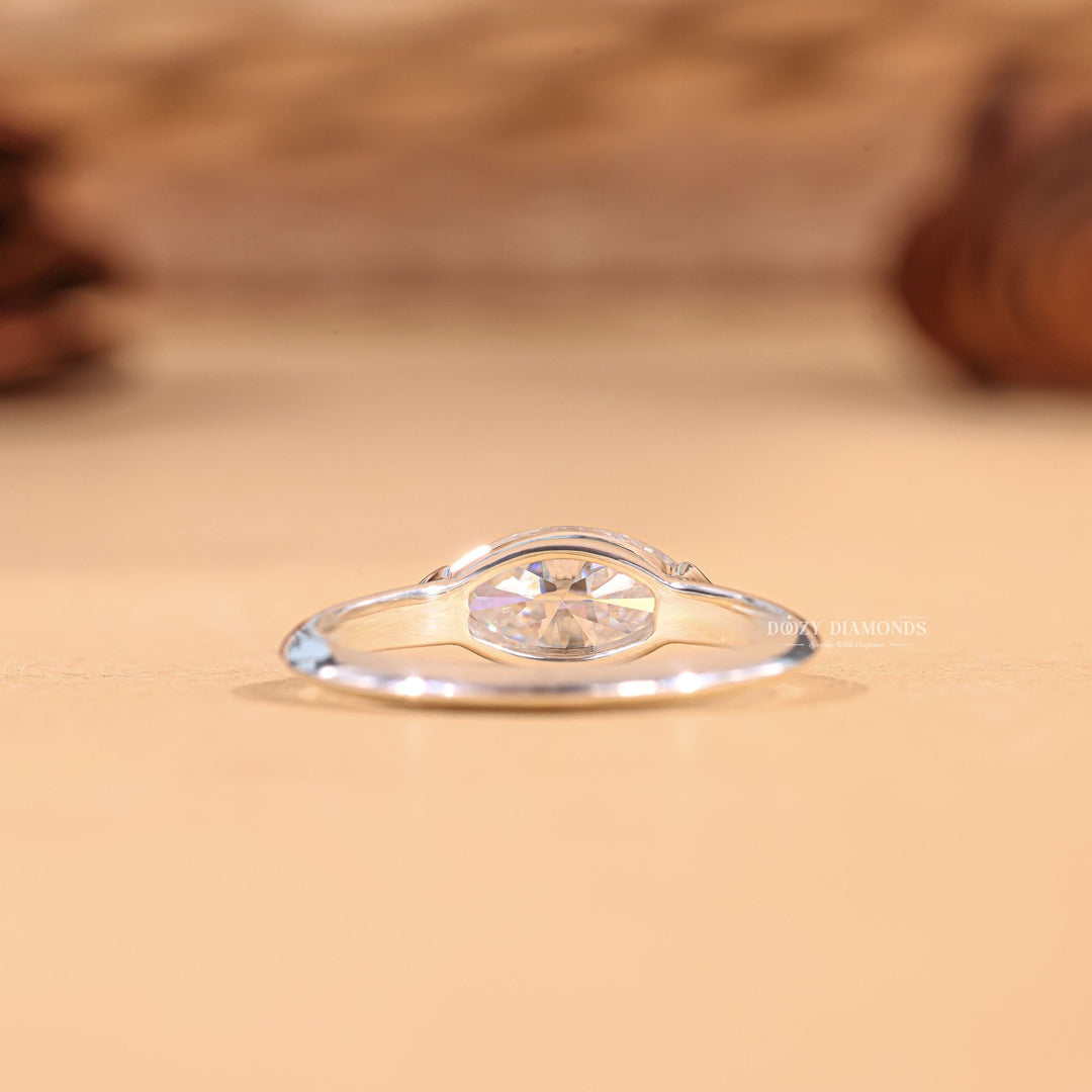 Profile view of marquise cut east west engagement ring band