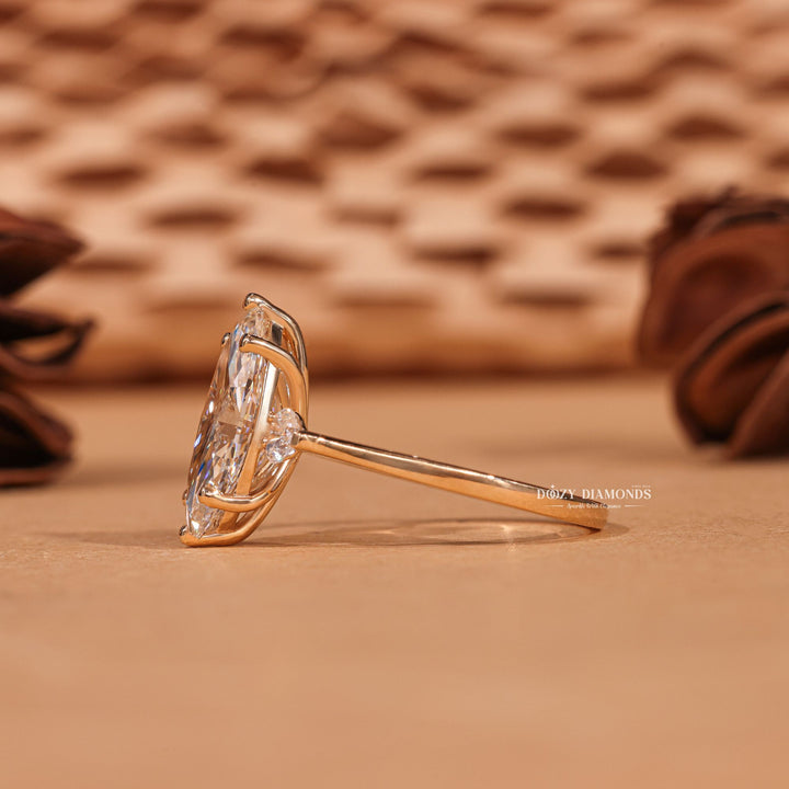 Marquise three stone lab grown diamond ring side profile in gold setting