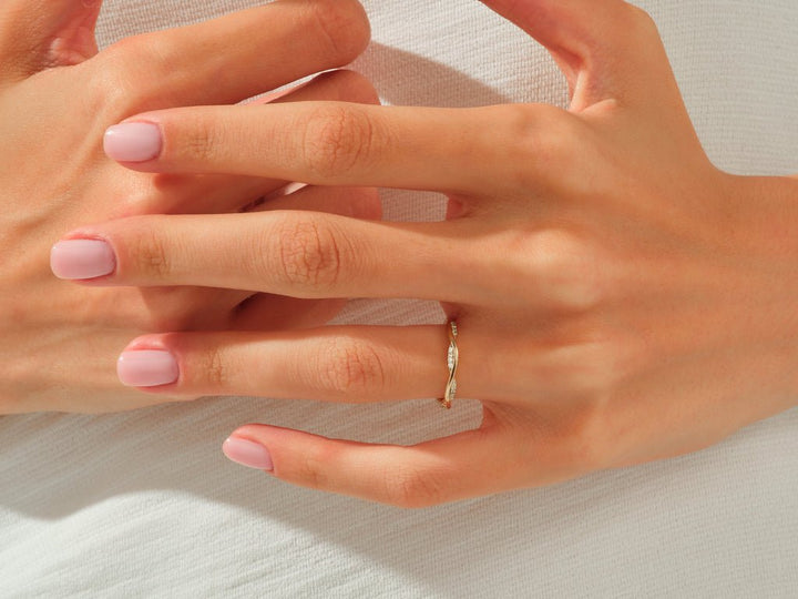 Round diamond wedding band in rose gold