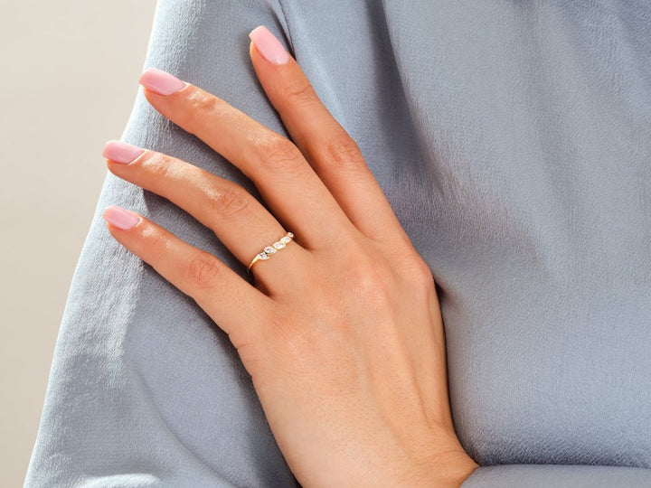 Side view of marquise diamond wedding band