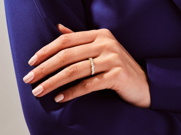 Side view of round, marquise, baguette diamond wedding band