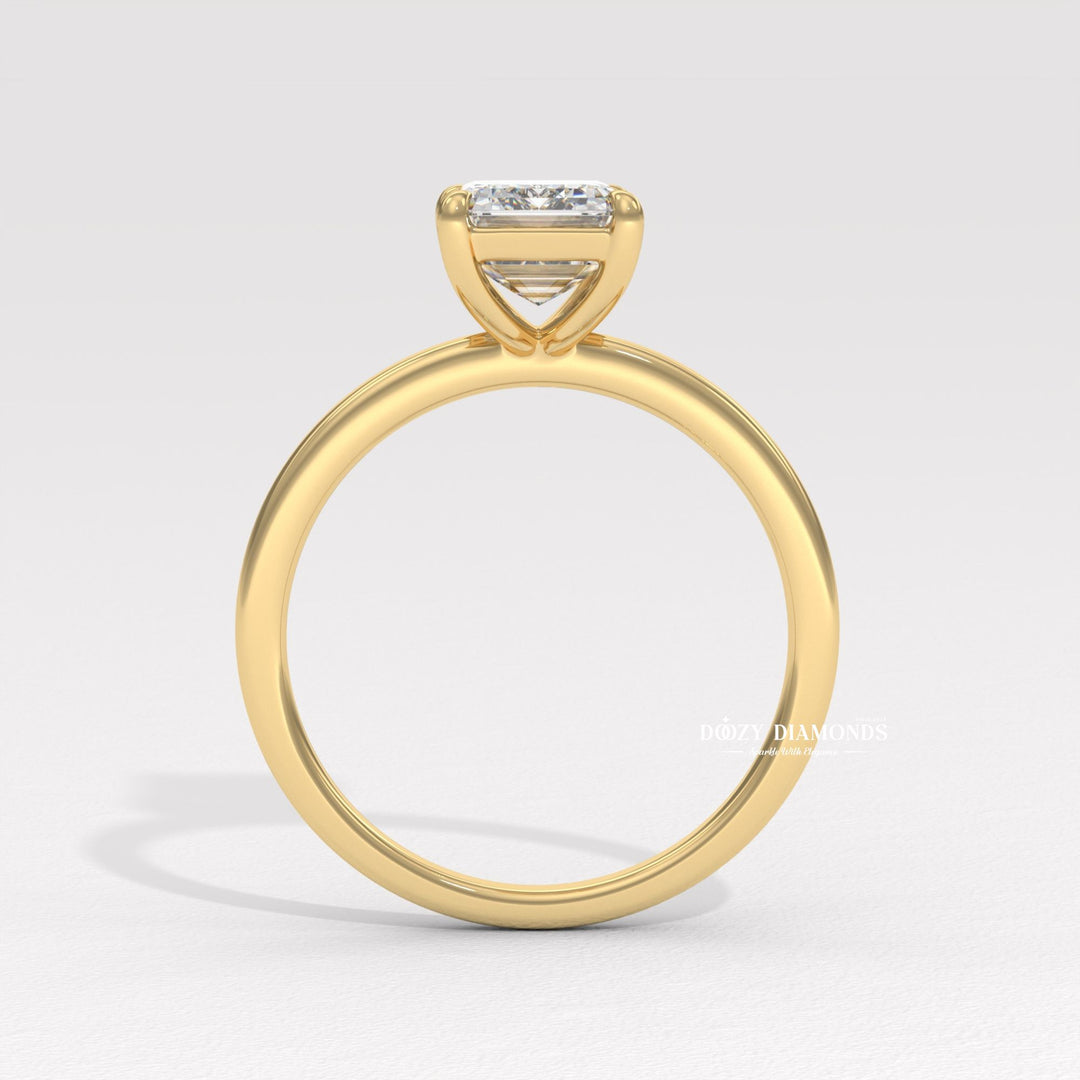 Fine craftsmanship detail on emerald solitaire engagement ring