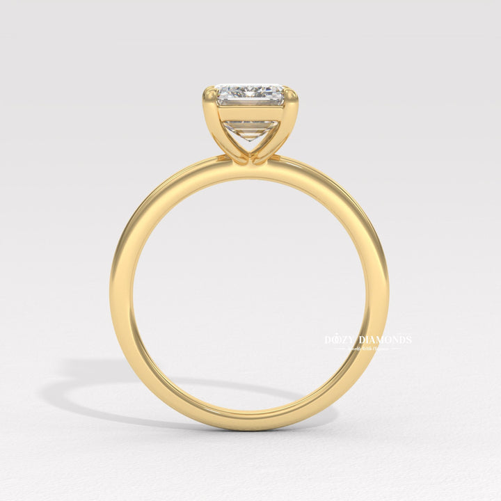 Fine craftsmanship detail on emerald solitaire engagement ring