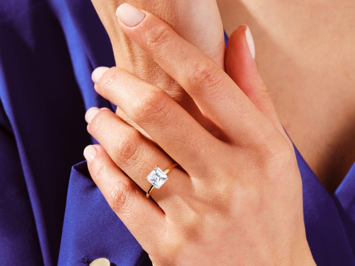 Profile view of princess cut solitaire engagement ring band