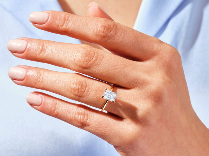 Premium emerald cut solitaire engagement ring crafted in solid gold
