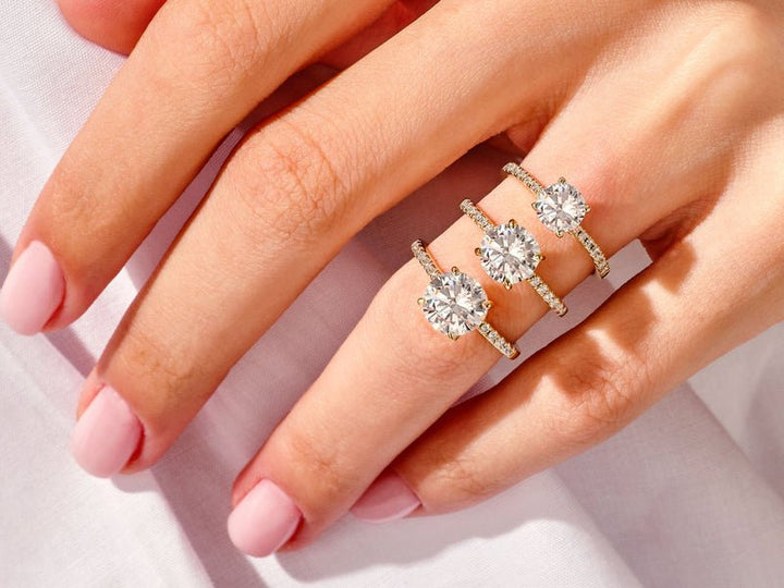 Round pave engagement ring photographed in natural light